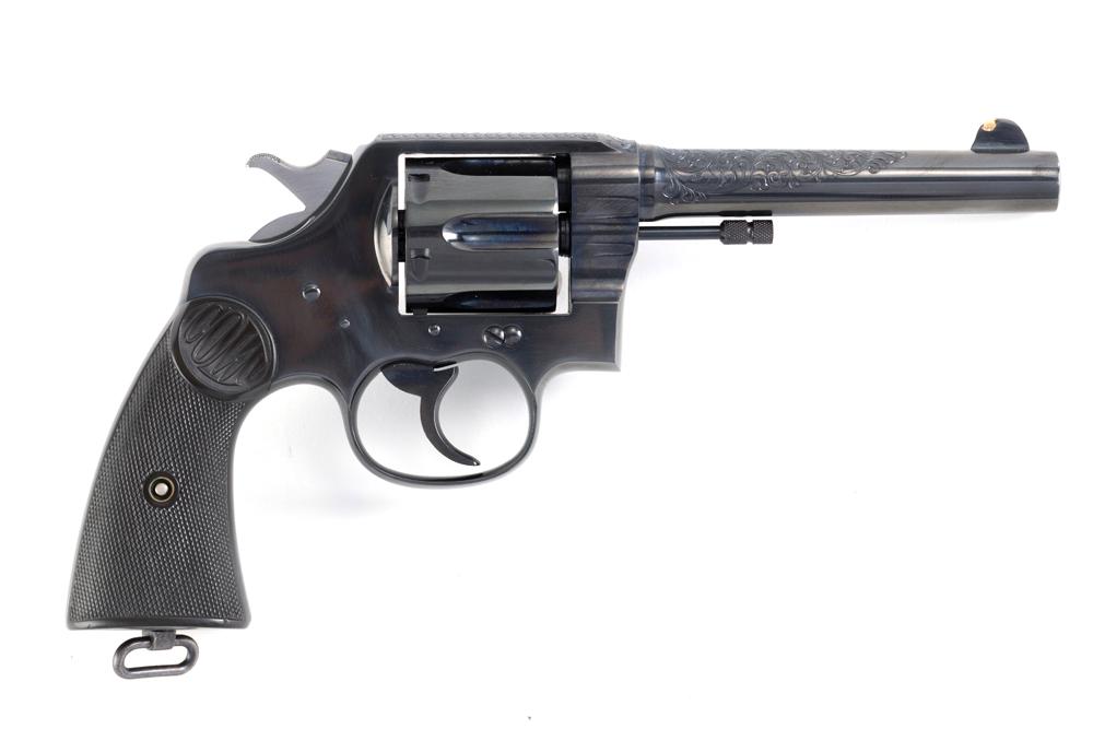 Colt New Service Model .45 Colt caliber, Serial Number 323301, manufactured in 1925, 5 1/2" barrel.: Colt New Service Model .45 Colt caliber, Serial Number 323301, manufactured in 1925, 5 1/2" barrel. Clean New Service with engraving on top of frame and barrel. Gold Bead added to front sight, gun sho