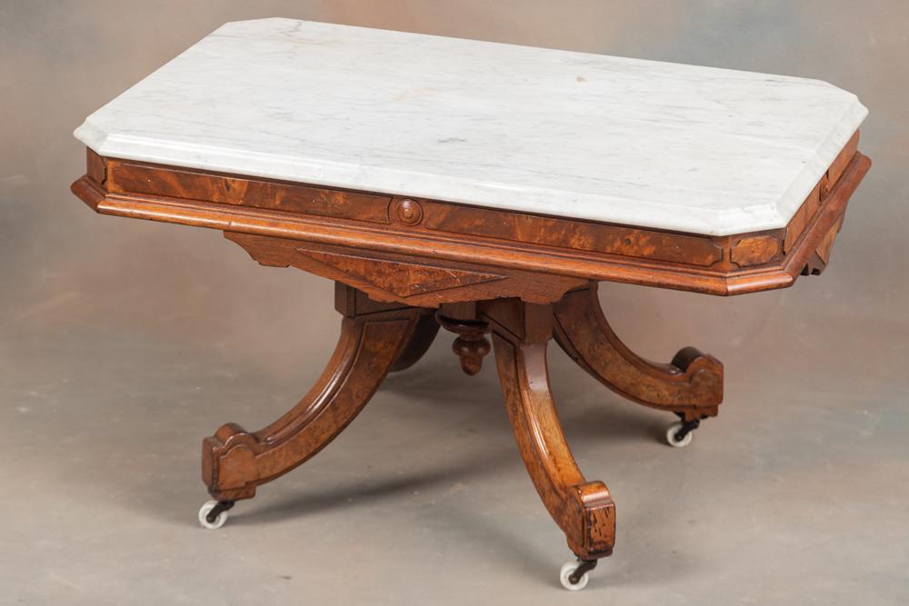 Antique Victorian Walnut marble top Coffee Table, circa 1880s, with original white porcelain: Antique Victorian Walnut marble top Coffee Table, circa 1880s, with original white porcelain rollers, measures 18" T, 30" L x 20" W original O.G. shaped marble top.