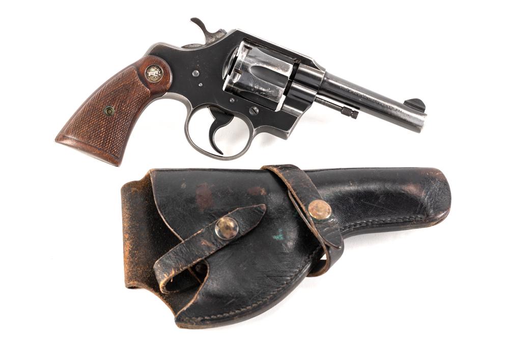 Colt Official Police Model, .38 Special caliber, Serial Number 827855, manufactured in 1953, 4": Colt Official Police Model, .38 Special caliber, Serial Number 827855, manufactured in 1953, 4" barrel. Normal condition Colt with finish loss in normal areas, serrated ramp front site. Sold with Blac
