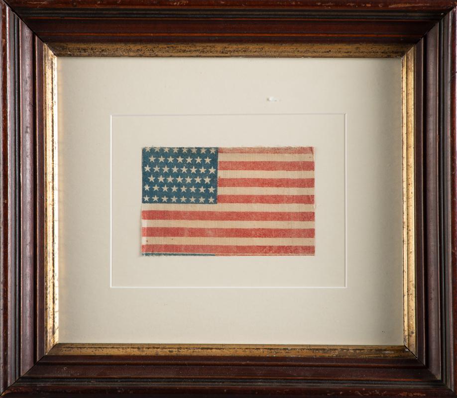 This lot consists of two custom framed Flags, one is the American Flag that measures 13 1/2" x 15: This lot consists of two custom framed Flags, one is the American Flag that measures 13 1/2" x 15 1/2". The other is the Texas Flag that measures 19 1/2" x 23 3/4". WILL BE SOLD AS ONE LOT.