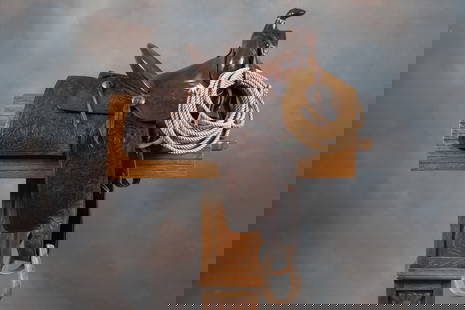 Vintage "R.T. Frazier, Pueblo, Colo." marked tooled Saddle, 12" seat, 4" cantle, maker marked 4: Vintage "R.T. Frazier, Pueblo, Colo." marked tooled Saddle, 12" seat, 4" cantle, maker marked 4 times, mounted with wooden oxbow stirrups. Saddle is in good condition, leather is supple with some