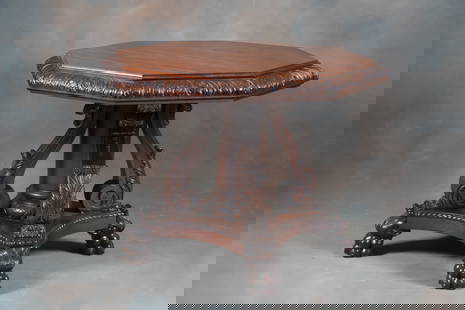 Extremely fine, highly carved wooden antique American Center Table, circa 1890-1900 with ornately: Extremely fine, highly carved wooden antique American Center Table, circa 1890-1900 with ornately carved claw foot base and unique octagon shaped top and floral carved edge. Attributed to Karpin