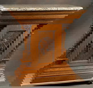 Antique oak Pedestal with polished granite top, measures 36 1/2" T x 37 1/4" W x 23" D. Embossed: Antique oak Pedestal with polished granite top, measures 36 1/2" T x 37 1/4" W x 23" D. Embossed Indian in headdress in front panel and carved oak columns supporting top, circa 1900.