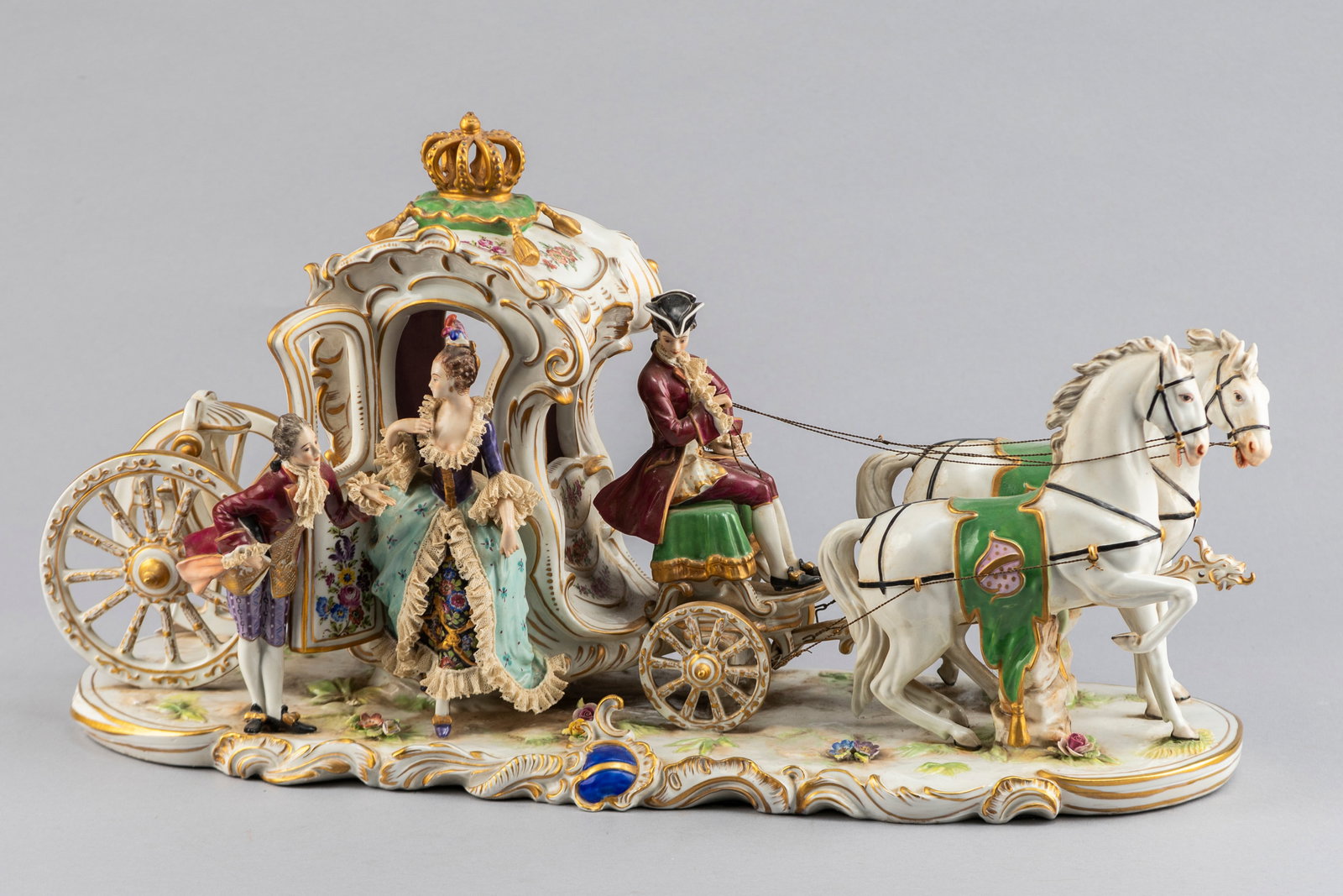 Beautiful Porcelain hand decorated Dresden Style Figurine, measures 22" long x 8 1/2" wide x 12" T: Beautiful Porcelain hand decorated Dresden Style Figurine, measures 22" long x 8 1/2" wide x 12" T to top of the coach. Coach has three figurines that have gold trim and porcelain flowers. Overall ver
