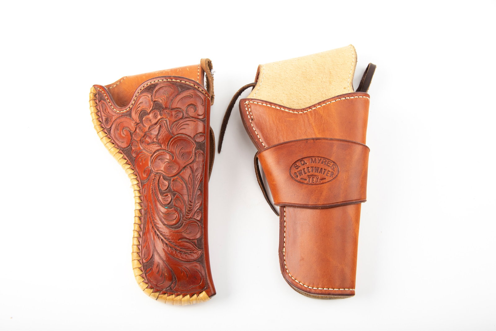 THIS LOT WILL BE SOLD 2 TIMES YOUR BID, MEANING YOUR FINAL BID WILL BE MULTIPLIED 2 TIMES. Two: THIS LOT WILL BE SOLD 2 TIMES YOUR BID, MEANING YOUR FINAL BID WILL BE MULTIPLIED 2 TIMES. Two Holsters, both marked "S.D. Myres, Sweetwater, Tex." One is a single loop, one is fully tooled, for a 4 3