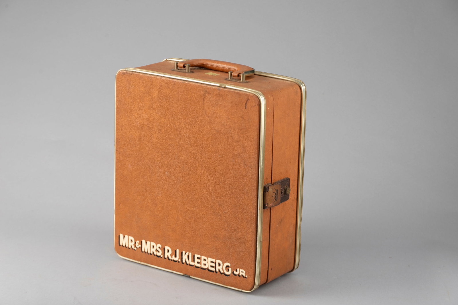Portable Liquor Case containing three bottles, 4-tumblers and 2-shot glasses, once owned by MR &: Portable Liquor Case containing three bottles, 4-tumblers and 2-shot glasses, once owned by MR & MRS, R.J. KLEBERG, JR. manager of the King Ranch, circa 1920s. Case measures 13 1/2" T x 5 1/2" D x 12"