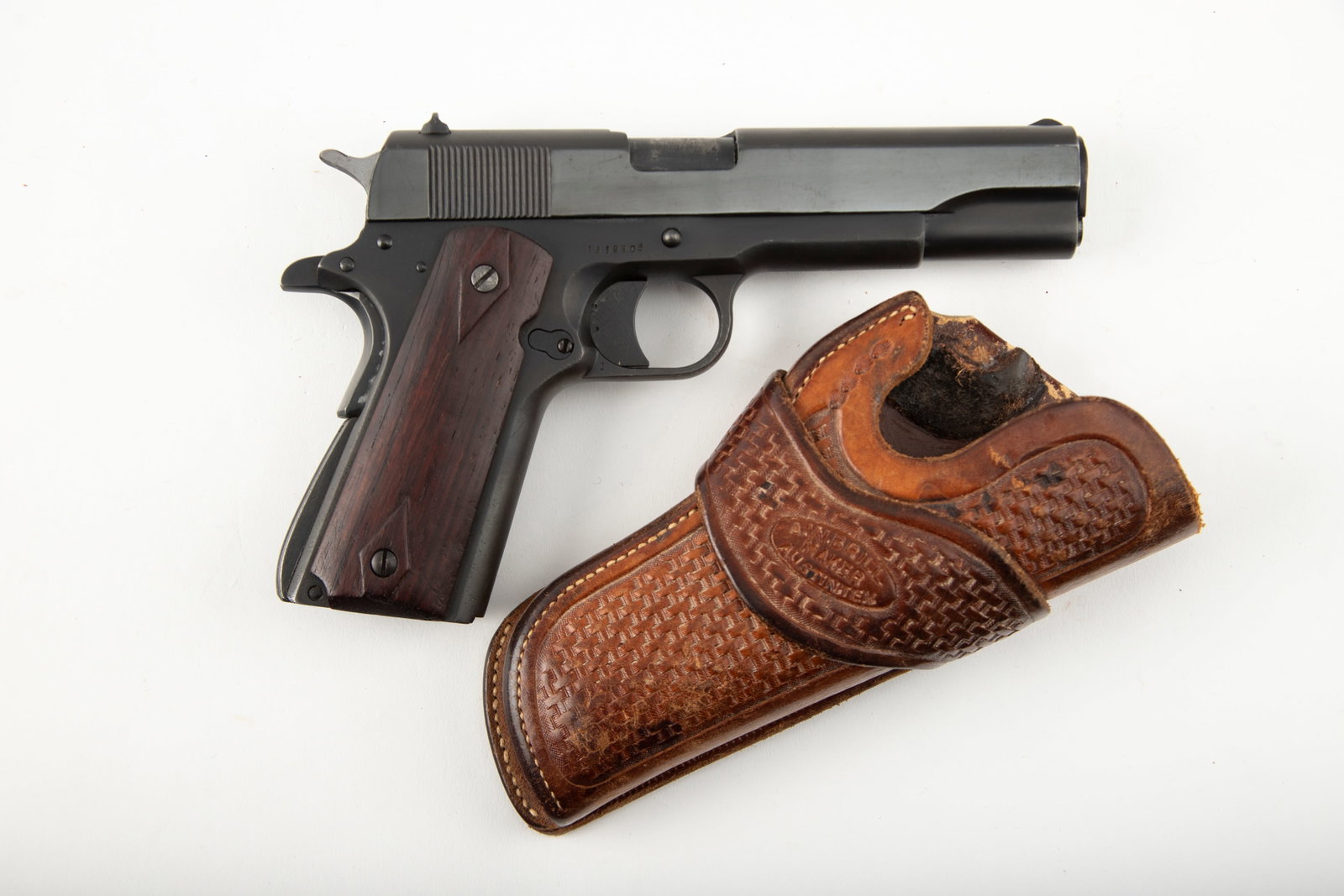 Remington Rand Model 1911A1, .45 ACP caliber, Auto Pistol, SN 1519906, 5" barrel. Typical WWII Era: Remington Rand Model 1911A1, .45 ACP caliber, Auto Pistol, SN 1519906, 5" barrel. Typical WWII Era Pistol, customized by the owner. High polish blue slide, matte finish, after market frame. Handmade R