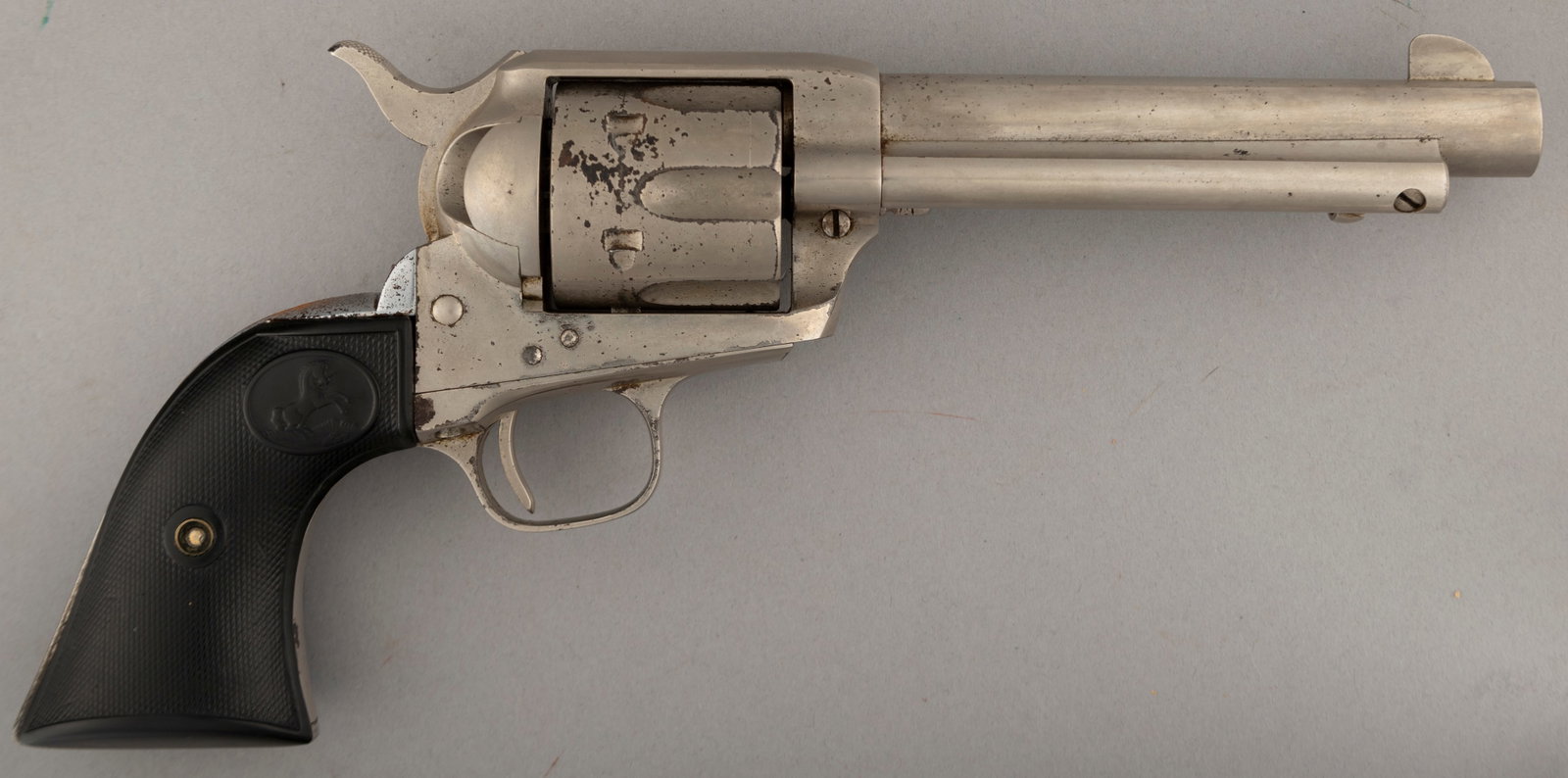 Colt SAA Revolver, .45 caliber, SN 353801, manufactured 1930, with 5 1/2" barrel and nickel finish.: Colt SAA Revolver, .45 caliber, SN 353801, manufactured 1930, with 5 1/2" barrel and nickel finish. Colt Records indicate blue finish and one gun shipment to Kansas. Most of the early refinish in nick