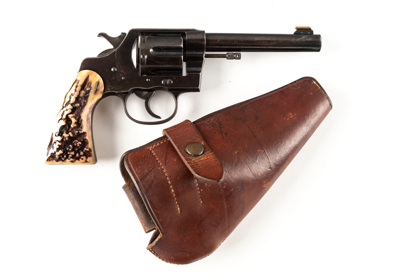 Colt New Service Model Revolver, .45 COLT caliber, SN 23713, manufactured in 1909, 5 1/2" barrel.: Colt New Service Model Revolver, .45 COLT caliber, SN 23713, manufactured in 1909, 5 1/2" barrel. Nice condition Colt for the age, fitted with custom front sight and beautiful Stag grips. Sold with le