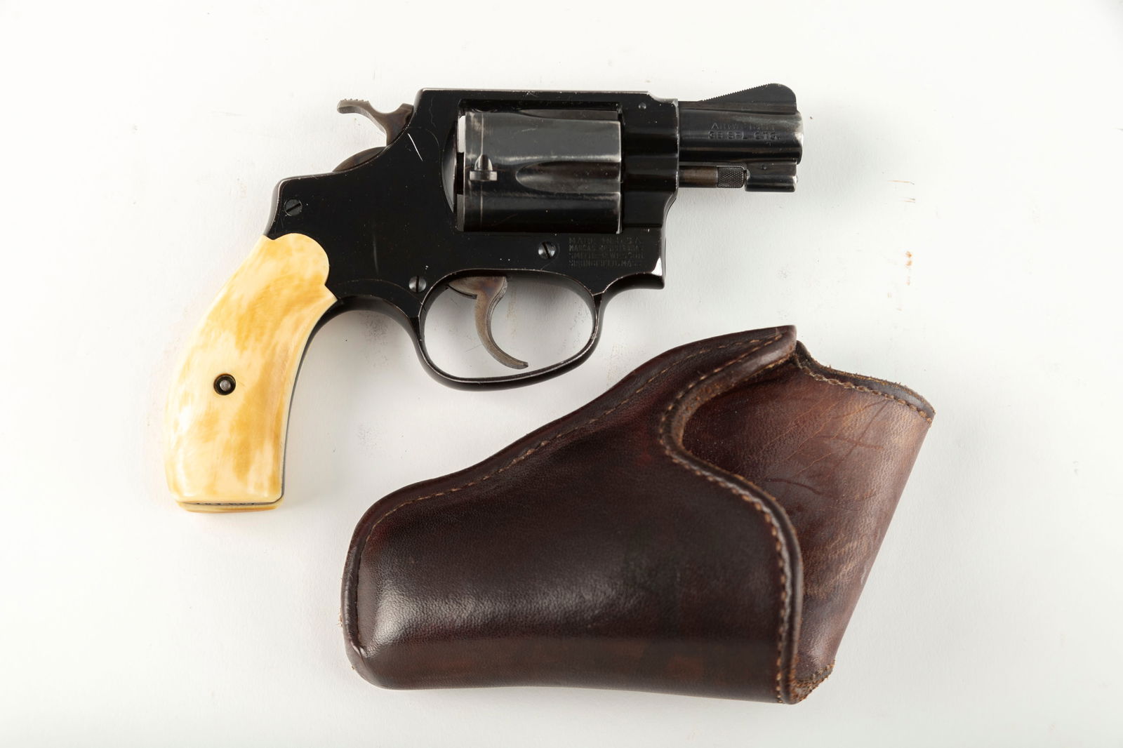 Smith and Wesson Pre-Model 37 Air Weight Revolver, .38 SPL caliber, SN 103484, manufactured in 1956,: Smith and Wesson Pre-Model 37 Air Weight Revolver, .38 SPL caliber, SN 103484, manufactured in 1956, 2" barrel. Nice condition Pre-37, fitted with bone grips. Sold with "S. D. Myres El Paso, Tex." mar