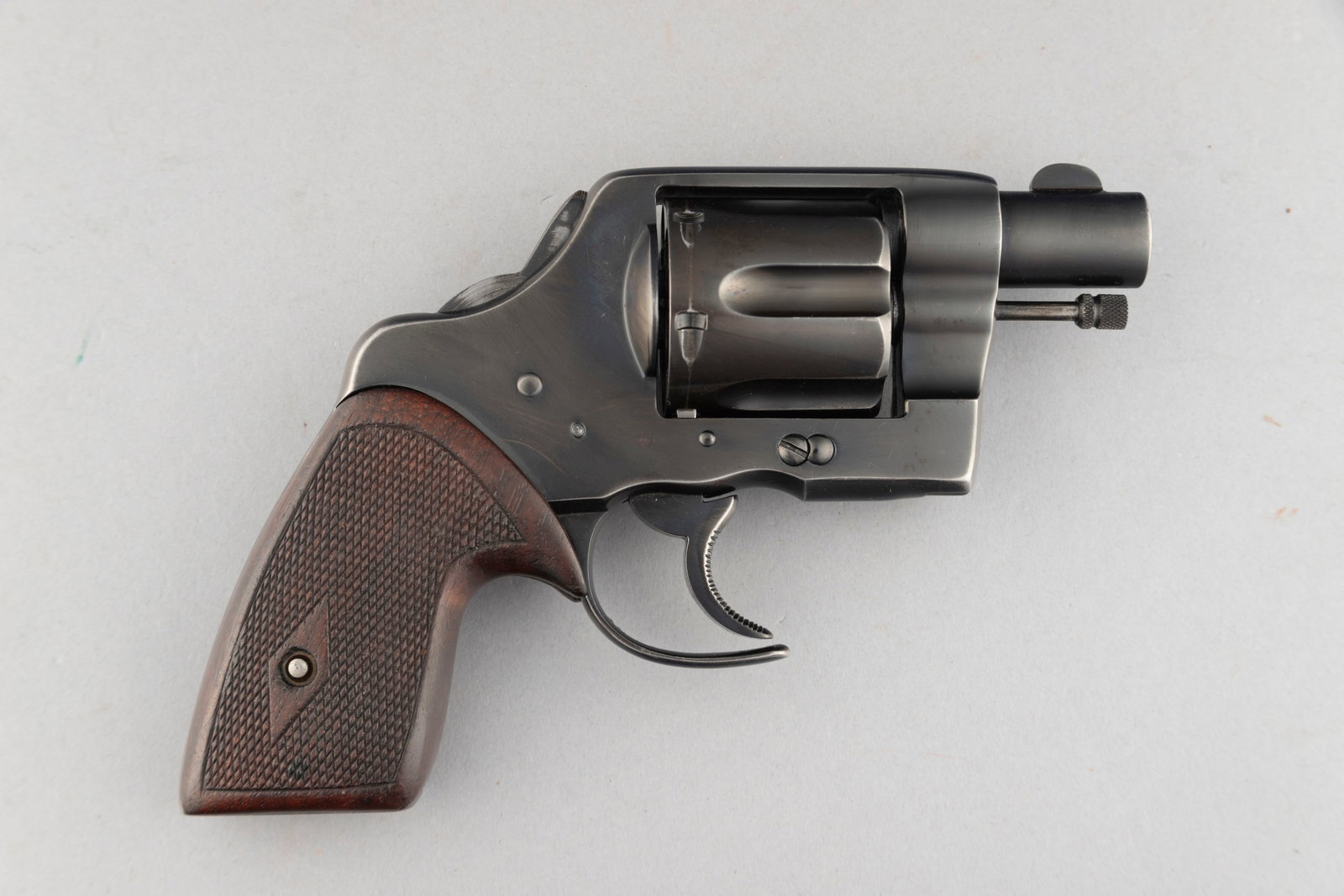Colt New Service Model Revolver, .45 COLT caliber, SN 10884, manufactured in 1904, 2" barrel.: Colt New Service Model Revolver, .45 COLT caliber, SN 10884, manufactured in 1904, 2" barrel. Customized Colt in the "Fitz" style with bobbed hammer, cut-a-way trigger guard and barrel shortened to 2"