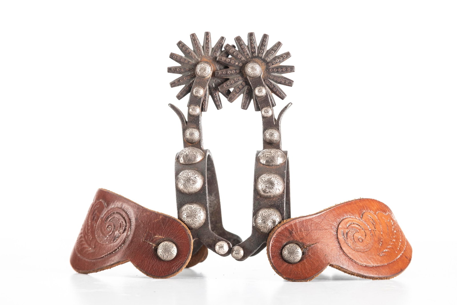 Pair of single mounted engraved overlay Spurs, Cheyenne, Wyoming style with split heel bands,: Pair of single mounted engraved overlay Spurs, Cheyenne, Wyoming style with split heel bands, multi-point rowels with chap guards. Spurs show use but in good condition, mounted with two-piece leather 