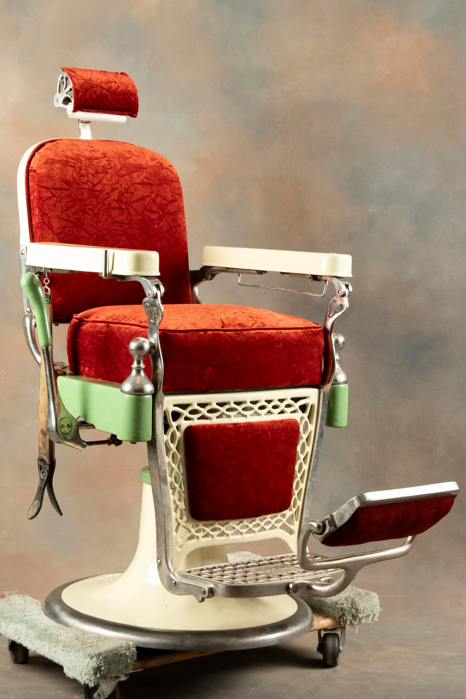 Antique two color porcelain Barber Chair manufactured by Emil J. Paidar, Chicago, circa 1930s,: Antique two color porcelain Barber Chair manufactured by Emil J. Paidar, Chicago, circa 1930s, mechanically sound, sold with genuine horsehide leather strap, porcelain is in good condition, chair meas