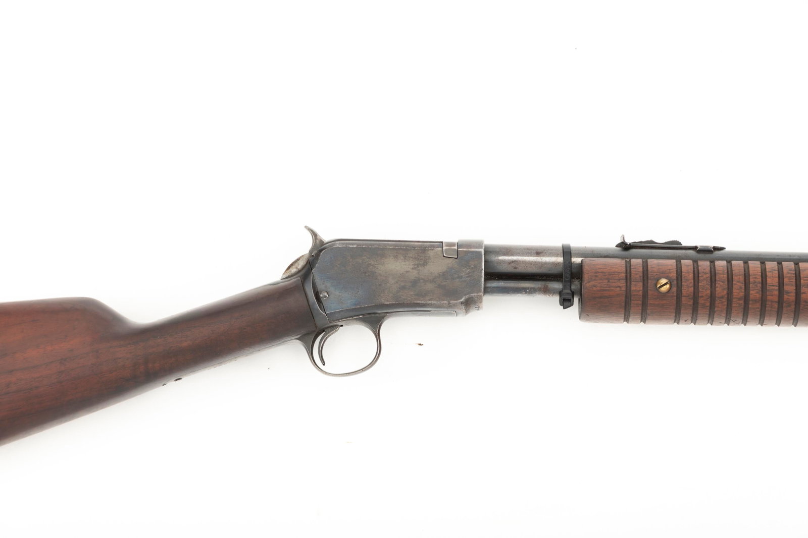 Winchester Model 62 Slide Action Rifle, .22 caliber, SN 179028, blue finish, 22" barrel showing some: Winchester Model 62 Slide Action Rifle, .22 caliber, SN 179028, blue finish, 22" barrel showing some thinning on finish, walnut stock, original butt plate. Mechanically sound, overall good condition. 