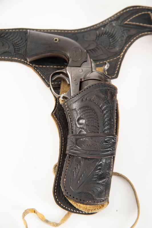 Black tooled Buscadero Rig, 36" waist, with matching single loop holster for 4 3/4" single action: Black tooled Buscadero Rig, 36" waist, with matching single loop holster for 4 3/4" single action revolver. Would go well with previous lot. Holster has leather tie downs. Belt is looped for .45 calib