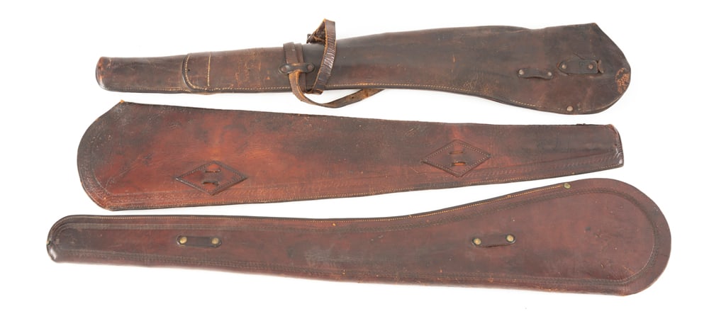 Collection of three vintage leather Saddle Scabbards for Carbines, all in good condition, all 35": Collection of three vintage leather Saddle Scabbards for Carbines, all in good condition, all 35" long, one is stamped "366", one is marked "R.T. Frazier, Pueblo. Colo". WILL BE SOLD AS ONE LOT.