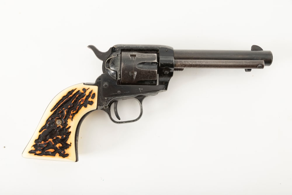 Colt Frontier Scout 62 Single Action Revolver, .22 LR caliber, SN 50372P, blue finish showing some: Colt Frontier Scout 62 Single Action Revolver, .22 LR caliber, SN 50372P, blue finish showing some remaining finish on cylinder, none remaining on barrel, 4 3/4" barrel. Plastic stag type grips. (MODE