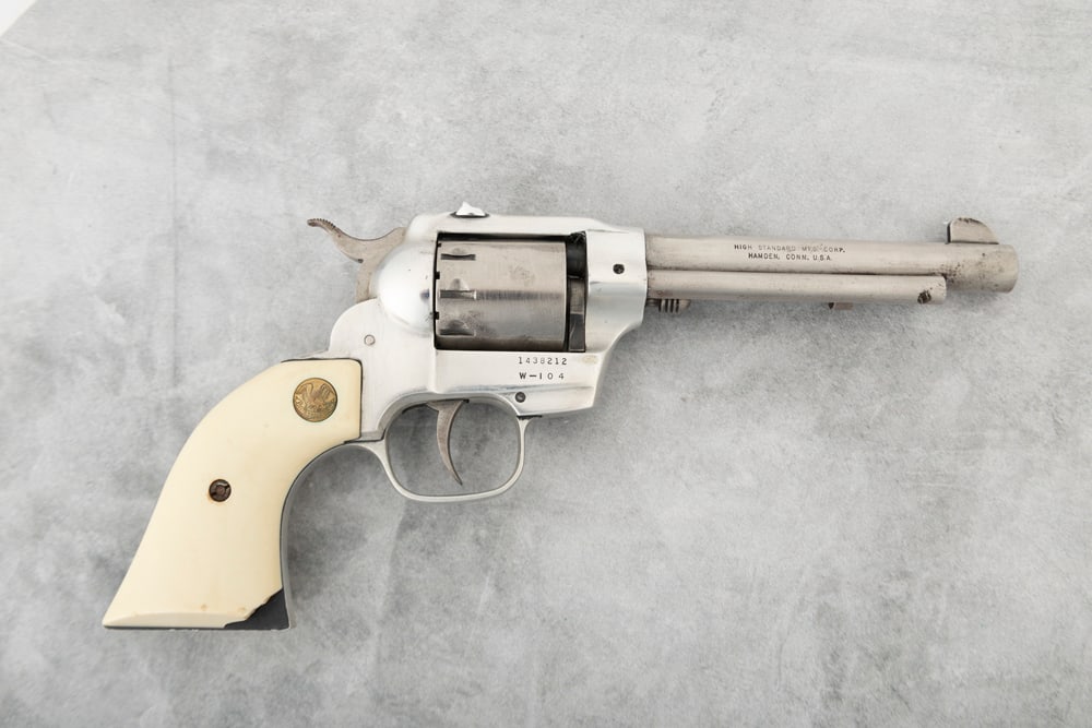 High Standard Double Nine, 9 shot Double Action Revolver, .22 caliber, SN 1438212, stainless, 5 1/2": High Standard Double Nine, 9 shot Double Action Revolver, .22 caliber, SN 1438212, stainless, 5 1/2" barrel, overall very good condition with exception of chip in right grip in toe area. (MODERN) THE 