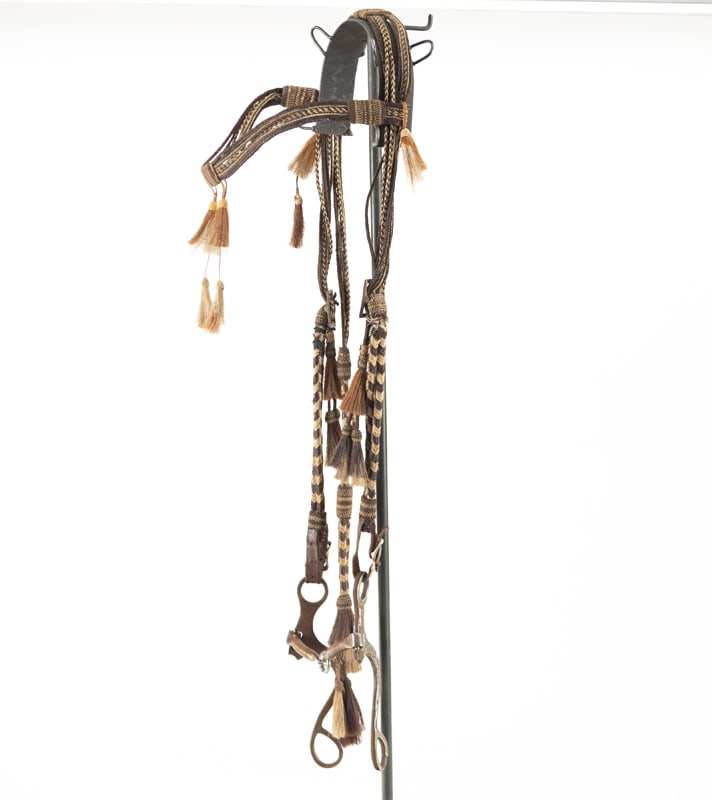 Early Horse Hair braided Bridle with fancy brow band. Head Stall is mounted with a silver mounted: Early Horse Hair braided Bridle with fancy brow band. Head Stall is mounted with a silver mounted Snaffle Bit. No maker mark visible but is very high quality.