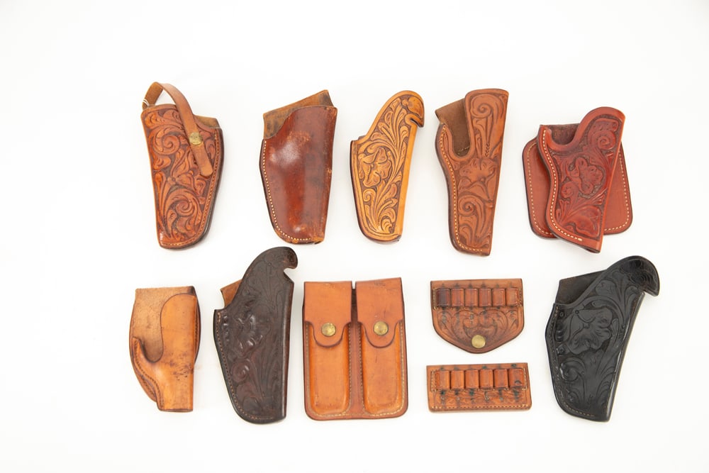 Collection of 11 pieces of vintage leather marked "S.D. Myres, El Paso, Tx." to include 8 Holsters 6: Collection of 11 pieces of vintage leather marked "S.D. Myres, El Paso, Tx." to include 8 Holsters 6 of which are tooled, 2 are plain, for automatics and small frame revolvers. Two tooled Belt Sliding