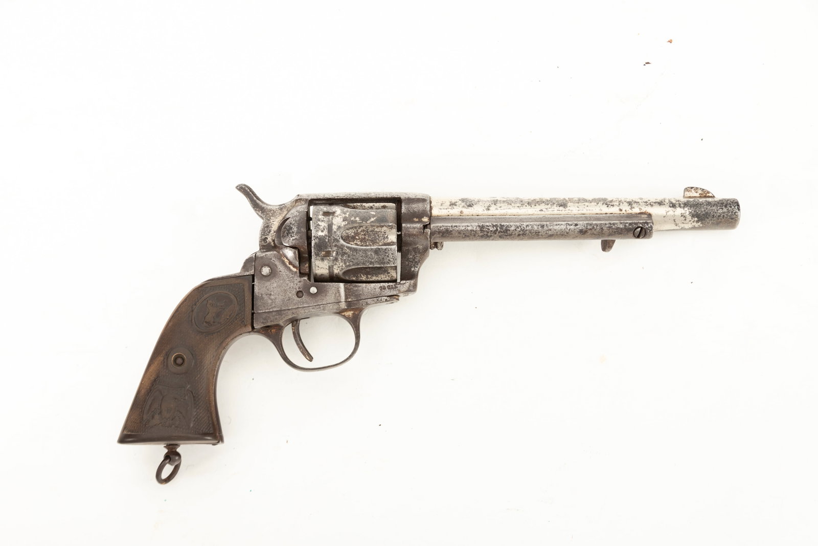 Antique Mexican copy of a Colt Single Action, .38 caliber, SN 4612, nickel finish, 5 3/4" barrel,: Antique Mexican copy of a Colt Single Action, .38 caliber, SN 4612, nickel finish, 5 3/4" barrel, hard rubber checkered grips, much original finish, balance is flaking.