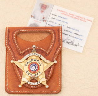 “CAPTAIN/ CALDWELL COUNTY/ SHERIFF?? marked 5-point Ball Star Badge with leather carrier and: “CAPTAIN/ CALDWELL COUNTY/ SHERIFF” marked 5-point Ball Star Badge with leather carrier and Agency Identification Card. Badge measures 2 ½” T x 2 ½” W, hallmarked
