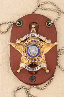 “DEPUTY/ CALDWELL COUNTY/ SHERIFF?? marked 5-point Ball Star Badge with two tone blue raised: “DEPUTY/ CALDWELL COUNTY/ SHERIFF” marked 5-point Ball Star Badge with two tone blue raised porcelain “State of Texas” center Seal, marked "Don Perry" with neck chain and leather