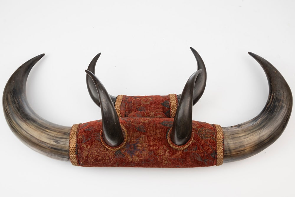 Exceptional Buffalo Horn hanging Hat Rack constructed of six matching buffalo horns. Rack measures: Exceptional Buffalo Horn hanging Hat Rack constructed of six matching buffalo horns. Rack measures 30" W x 12" T, in extremely fine condition. One of the nicest racks to surface in years! THE LATE OTI