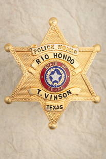Gold tone 6-point Ball Star Badge, marked “POLICE WOMAN /RIO HONDO, TEXAS?? / T. Vinson",: Gold tone 6-point Ball Star Badge, marked “POLICE WOMAN /RIO HONDO, TEXAS” / T. Vinson", measures 2 ½” T x 2 ¼” W –Hallmark "Blackinton". THE LATE DON PERRY