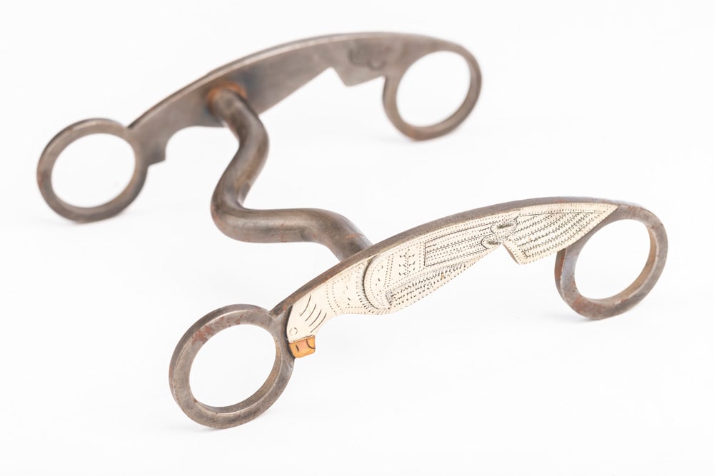 Beautiful silver mounted Bit engraved in the parrot pattern by noted Texas Bit and Spur Maker Don: Beautiful silver mounted Bit engraved in the parrot pattern by noted Texas Bit and Spur Maker Don Peirce. NOTE: Great detail. THE LATE OTIS HIBLER ESTATE..