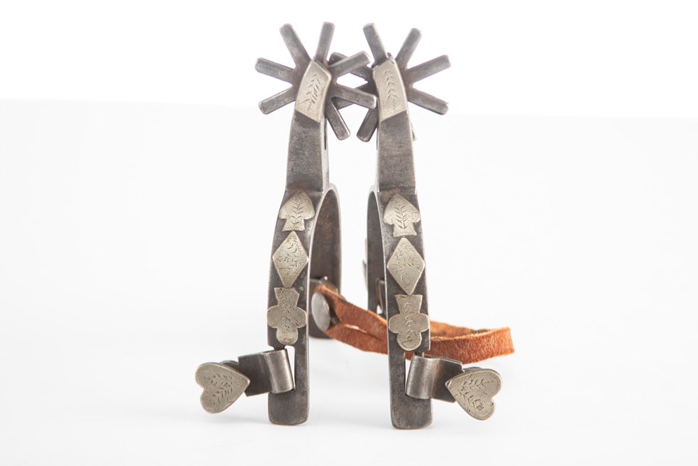 "J.O. Bass. Tulia, Tex." marked single mounted Spurs, #1388, will be accompanied by a write up taken: "J.O. Bass. Tulia, Tex." marked single mounted Spurs, #1388, will be accompanied by a write up taken from J.O. Bass's notes pertaining to this pair of spurs. THE LATE OTIS HIBLER ESTATE.