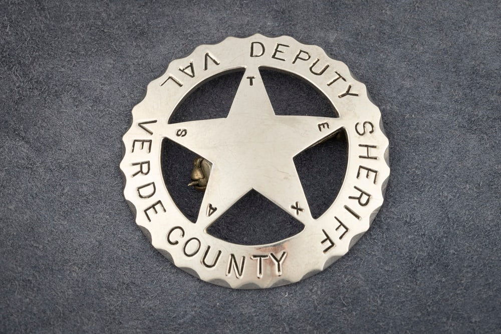 Beautiful circle cut-out 5-point Star Badge with scalloped edge marked “DEPUTY SHERIFF/ VAL VERDE: Beautiful circle cut-out 5-point Star Badge with scalloped edge marked “DEPUTY SHERIFF/ VAL VERDE COUNTY” with “TEXAS” spelled out on points on star. Silver tone with flat bar pin and 