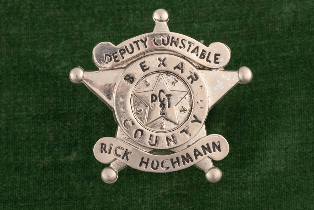 Silver tone 5-point ball tipped Star Badge with applied banners marked “DEPUTY CONSTABLE / BEXAR: Silver tone 5-point ball tipped Star Badge with applied banners marked “DEPUTY CONSTABLE / BEXAR COUNTY / RICK HOCHMAN”, measures 2” T x 2” W. Center Seal marked “PCT 2, TEXAS&rd