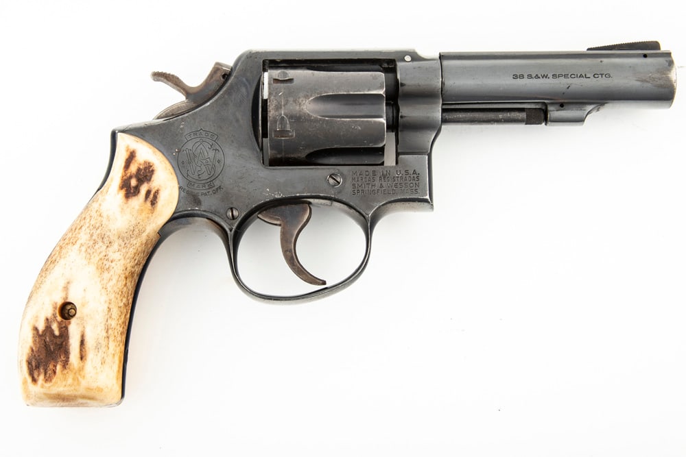 Smith & Wesson, Model 10-5, DA Revolver, .38 S&W SPL caliber, SN D751823, blue finish, 5" heavy: Smith & Wesson, Model 10-5, DA Revolver, .38 S&W SPL caliber, SN D751823, blue finish, 5" heavy barrel, overall very good condition with some light thinning at muzzle. Polished buck horn 2-piece grips