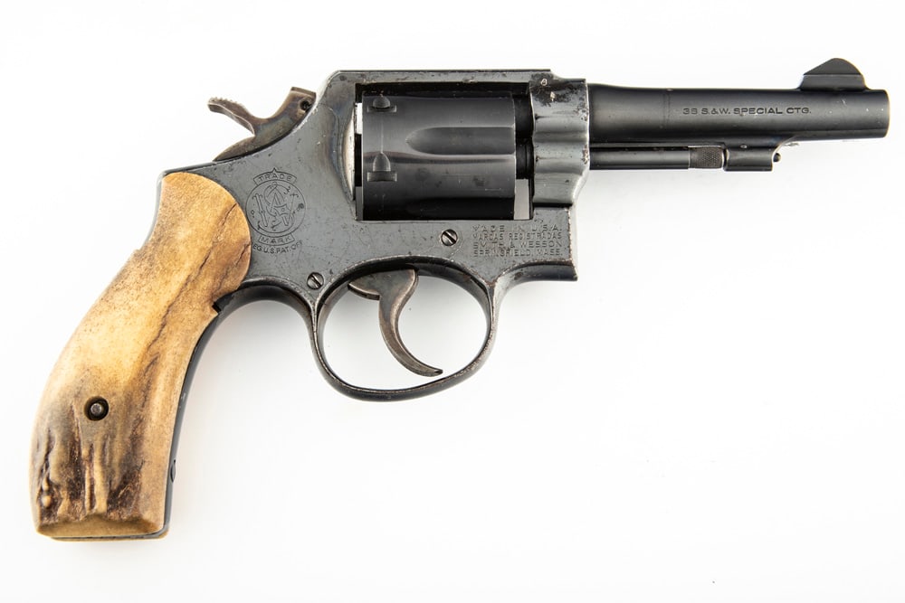 Smith & Wesson, Model 10-5 DA Revolver, .38 S&W SPL caliber, SN D544607, blue finish, 4" barrel,: Smith & Wesson, Model 10-5 DA Revolver, .38 S&W SPL caliber, SN D544607, blue finish, 4" barrel, overall very good condition with fine turn line. Mounted with a pair of polished buck horn grips. (MODE