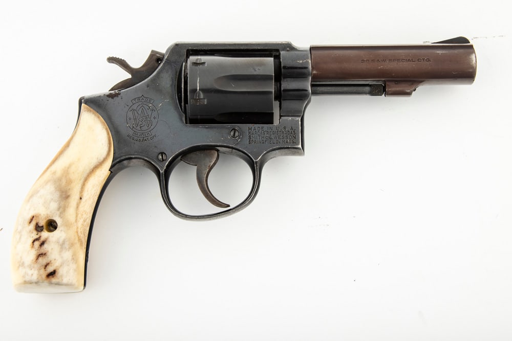 Smith & Wesson, Model 10-5 DA Revolver, .38 S&W SPL caliber, SN D196270, blue finish with off color: Smith & Wesson, Model 10-5 DA Revolver, .38 S&W SPL caliber, SN D196270, blue finish with off color heavy barrel, 3 3/4" heavy barrel. Overall good condition. Sold with polished buck horn 2-piece grip