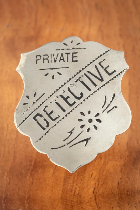 Stock Shield Badge marked “PRIVATE / DETECTIVE?? in nice condition, silver tone with black enamel: Stock Shield Badge marked “PRIVATE / DETECTIVE” in nice condition, silver tone with black enamel writing, measures 2 ¼” T x 1 ¾” W, with working spring pin and catch.