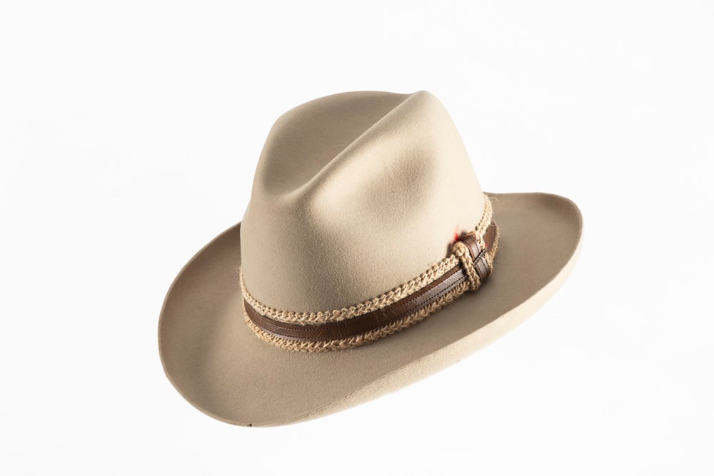 Hat once belonging to Dusty Hill of ZZ Top Fame: Tan "THE GUN CLUB BY STETSON", Hat, 3X Beaver, size: Hat once belonging to Dusty Hill of ZZ Top Fame: Tan "THE GUN CLUB BY STETSON", Hat, 3X Beaver, size 7 3/8, from the Portland, Oregon Outdoor Store, personalized ownership card tucked into interior ha