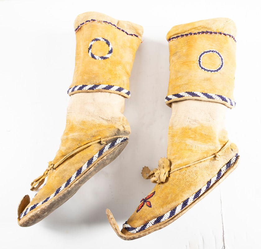 A pair of 1890s beaded Cactus Kicker Tall Top Native American Moccasins in great condition with: A pair of 1890s beaded Cactus Kicker Tall Top Native American Moccasins in great condition with original toe tips and trimmed with beads, 9 1/2" tops.