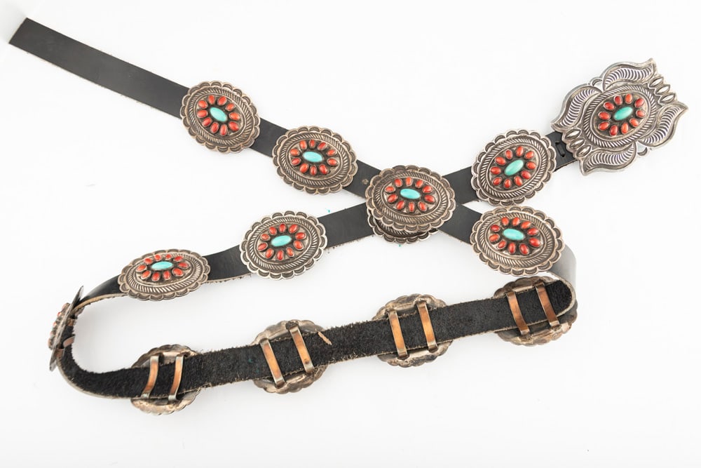 Beautiful Concho Belt with 13 oval silver and turquoise 2" raised conchos and matching buckle,: Beautiful Concho Belt with 13 oval silver and turquoise 2" raised conchos and matching buckle, measures 41" long. Maker mark is an arrowhead with initials "C.MTZ/Sterling". THE PAULA CRIM COLLECTION.