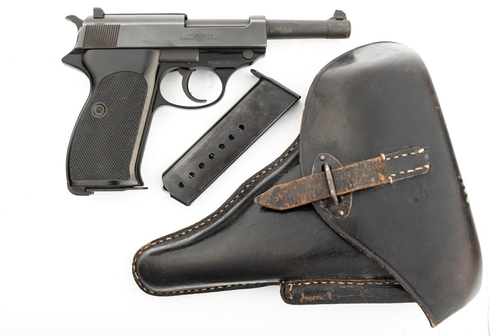 Walther Model P1 Semi-Auto Pistol, 9mm, SN 321144, excellent blue finish, 5" barrel, very fine: Walther Model P1 Semi-Auto Pistol, 9mm, SN 321144, excellent blue finish, 5" barrel, very fine condition with original plastic checkered grips, in leather flap Holster with one extra magazine. (MODERN