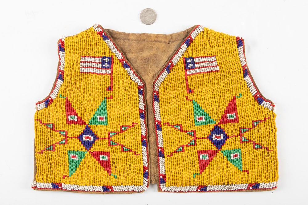 Miniature fully beaded Vest on cloth backing, measures 9 1/2" W x 7" T with multi-color beads with: Miniature fully beaded Vest on cloth backing, measures 9 1/2" W x 7" T with multi-color beads with fully beaded border, circa 1920s-30s. THE BUDDY KING COLLECTION.