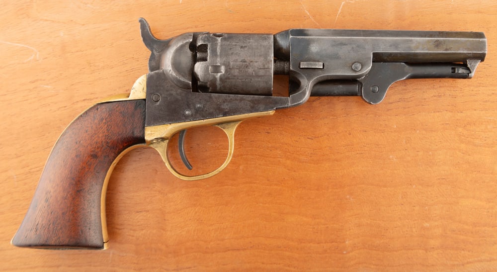 Antique Colt 1849 Pocket Model Revolver, .31 caliber, SN 322226, 4" barrel, finish is dark grey: Antique Colt 1849 Pocket Model Revolver, .31 caliber, SN 322226, 4" barrel, finish is dark grey smooth patina, brass trigger guard and back strap, has all matching serial numbers with replaced wedge, 