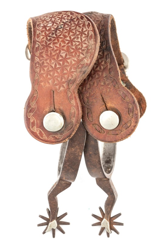 Pair of single mounted "Kelly Bros" marked gal-legs with silver slippers Spurs, Pattern #50, circa: Pair of single mounted "Kelly Bros" marked gal-legs with silver slippers Spurs, Pattern #50, circa 1920s, sold with a pair of two-piece straps. THE BUDDY KING COLLECTION.