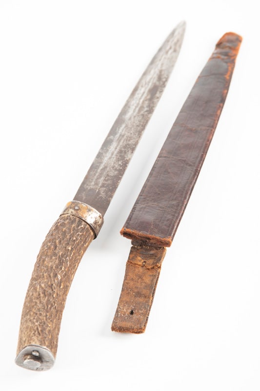 Long Spear Point Side Knife with Buck Horn Handle, sold with leather sheath, sheath is fragile at: Long Spear Point Side Knife with Buck Horn Handle, sold with leather sheath, sheath is fragile at tip. Blade measures 8 1/4", and is 13 1/4" overall. THE LATE DR. ED KOLLAR ESTATE.