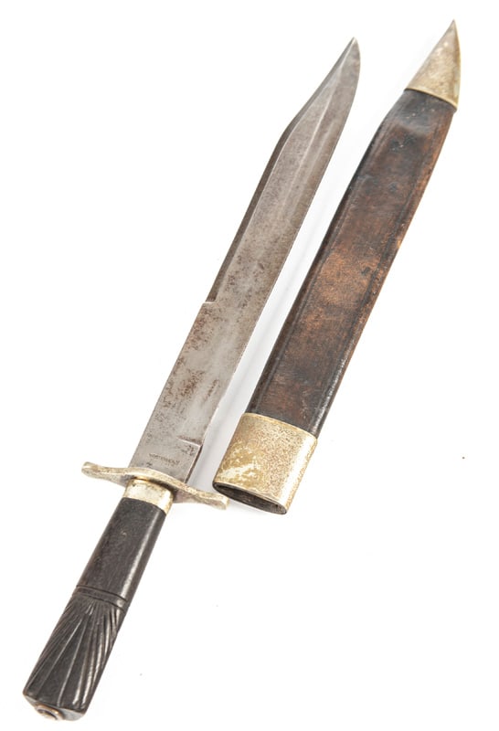 Vintage Clip Point Bowie Knife, ricasso is marked "Wostenholm Sheffield", heavy brass cross guard: Vintage Clip Point Bowie Knife, ricasso is marked "Wostenholm Sheffield", heavy brass cross guard and carved wooden handle, 11 3/4" blade, 16 3/4" overall length. Sold in original leather sheath with 