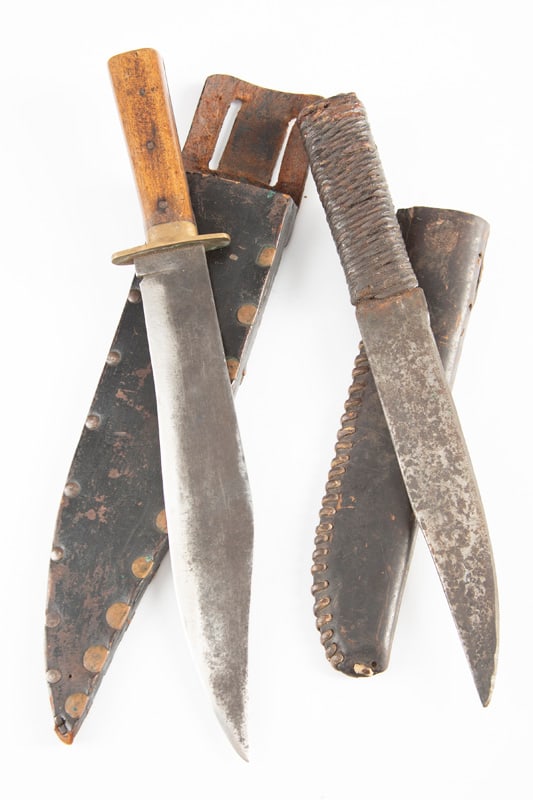 This lot consists of two (2) Bowie Knives to include: (1) Early handmade Clip Point Bowie Knife,: This lot consists of two (2) Bowie Knives to include: (1) Early handmade Clip Point Bowie Knife, unmarked, 10 1/2" blade, overall 15" with brass cross guard and wooden handle. Sold in a handmade heavy