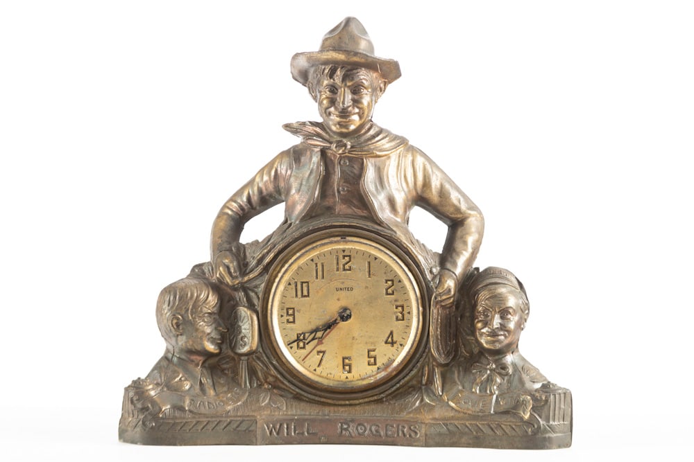 A 1940s electric Figural Mantle Clock of Will Rogers, Radio & Movie Star, metal figure with original: A 1940s electric Figural Mantle Clock of Will Rogers, Radio & Movie Star, metal figure with original copper flashing, 12 1/2" T x 12 1/2"" W. Clock is running at this time . As with all estate found c