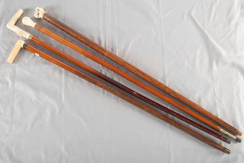 THIS LOT WILL BE SOLD 4 TIMES YOUR BID, MEANING YOUR FINAL BID WILL BE MULTIPLIED 4 TIMES.: THIS LOT WILL BE SOLD 4 TIMES YOUR BID, MEANING YOUR FINAL BID WILL BE MULTIPLIED 4 TIMES. This lot consists of two Canes & two Walking Sticks: (1) Ivory handled Presentation Cane with raised carved R