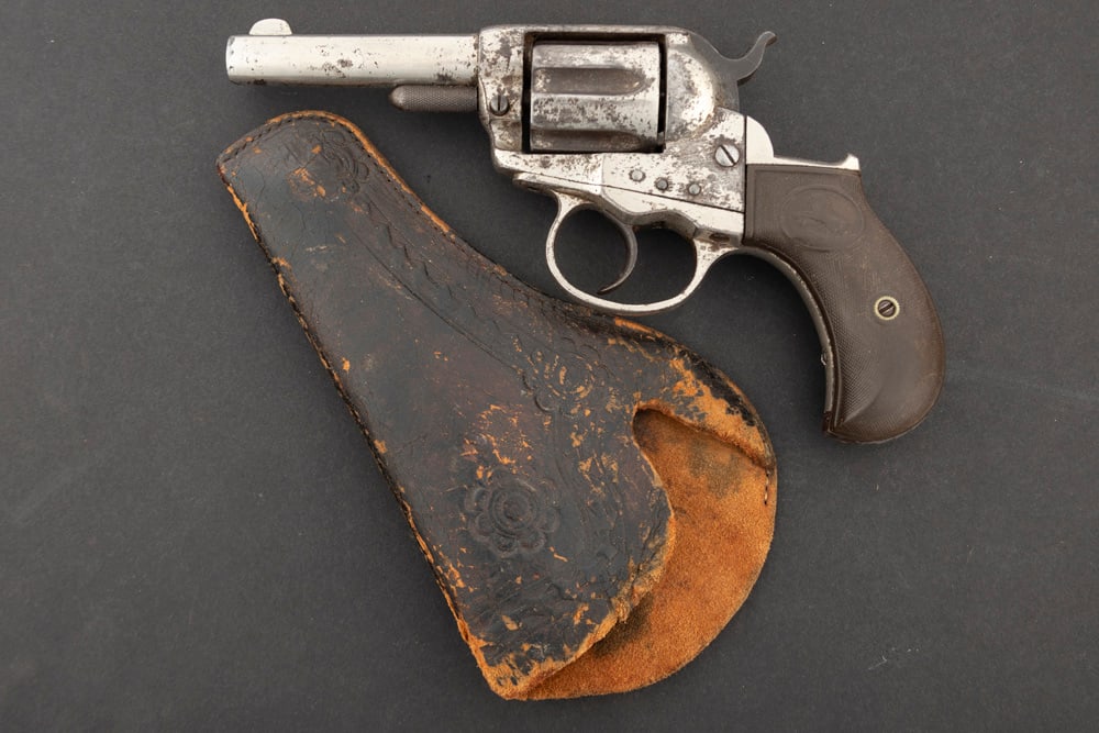 Antique Colt Model 1877 Lightning DA Revolver, .38 caliber, SN 17840, manufactured 1879, retains: Antique Colt Model 1877 Lightning DA Revolver, .38 caliber, SN 17840, manufactured 1879, retains approximately 40% original nickel finish, showing some spotting, 3 1/2" barrel, original 2-piece checke